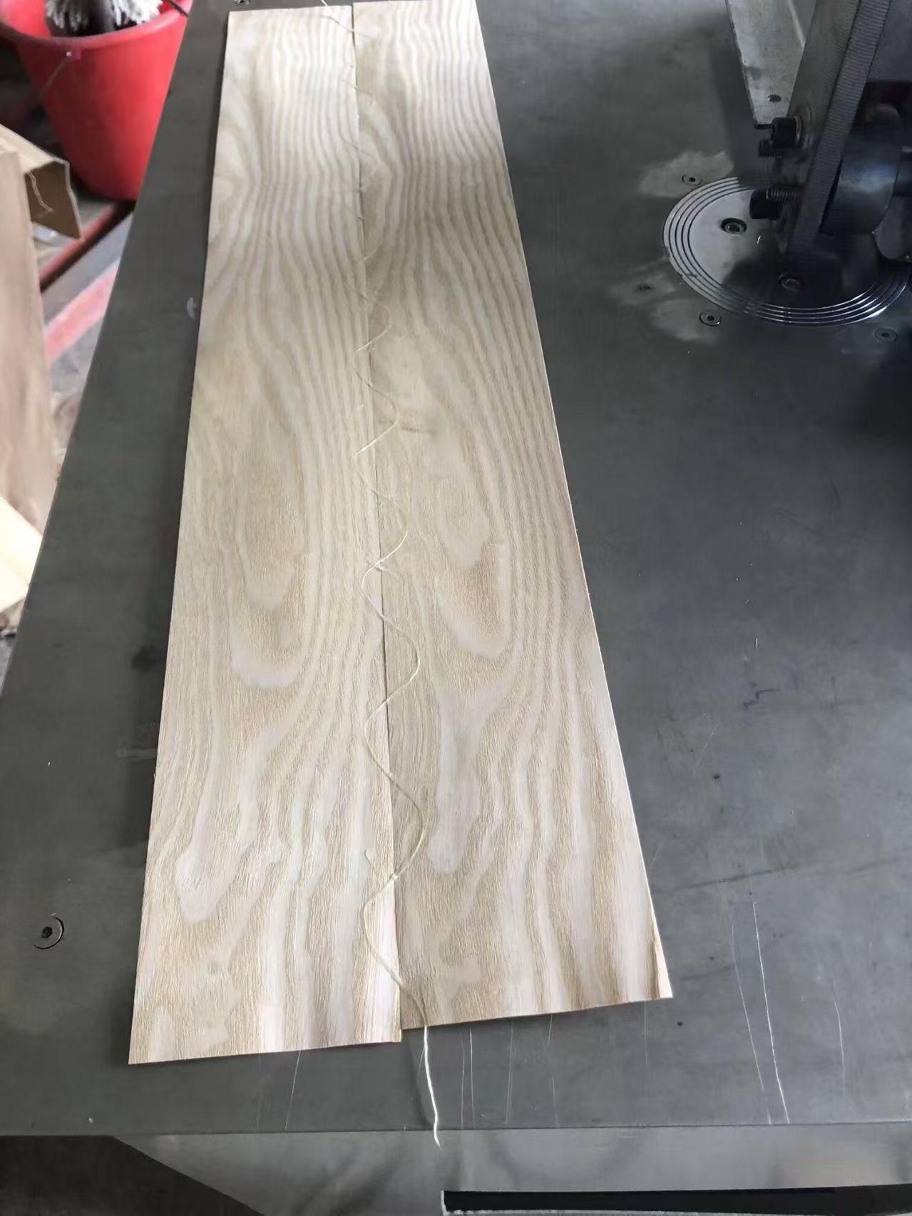Close-up veneer zig-zag seam after splicing